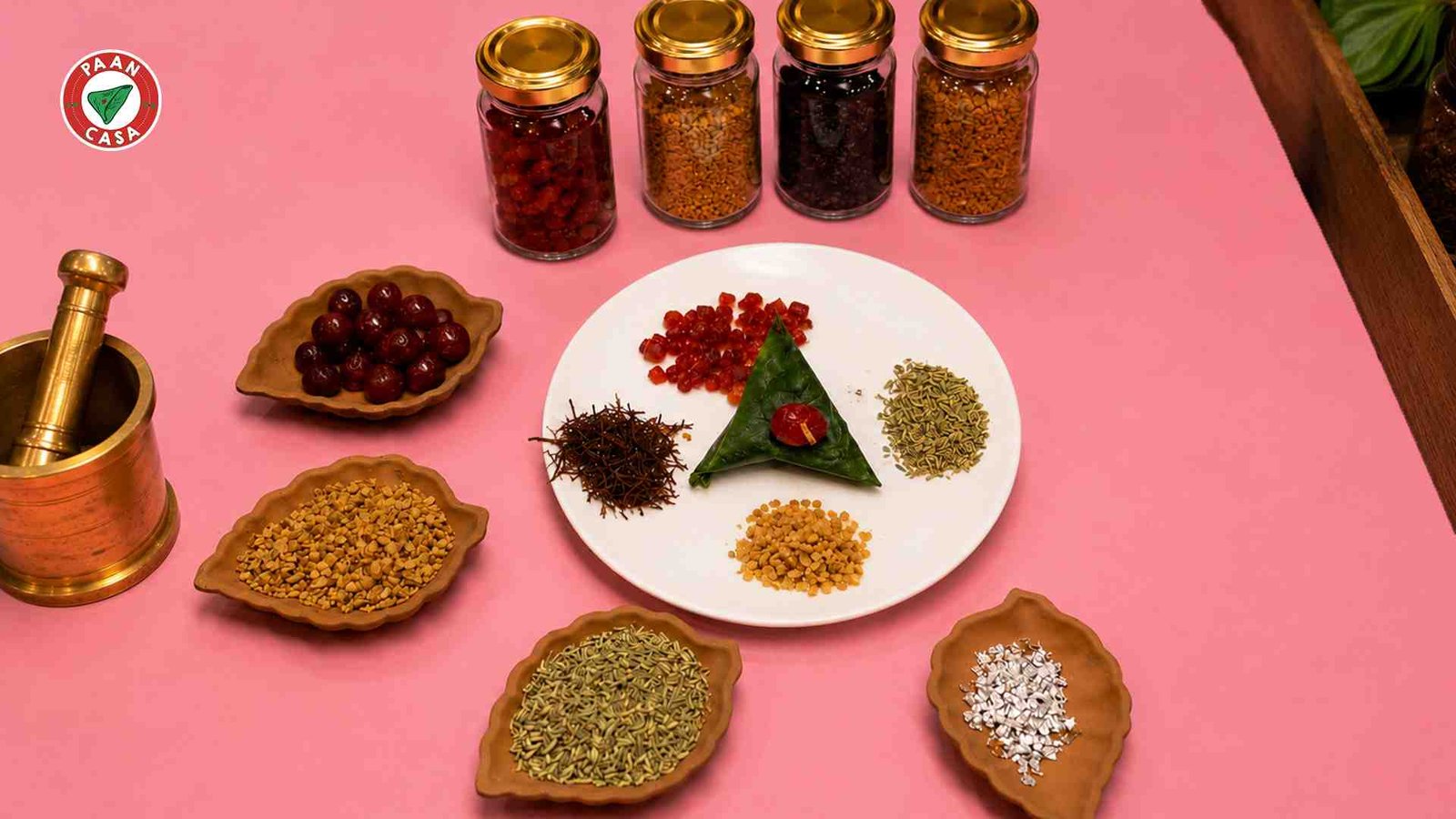 Paan ingredients and packaged products displayed in a modern cafe.